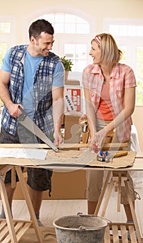 Happy couple improving new house