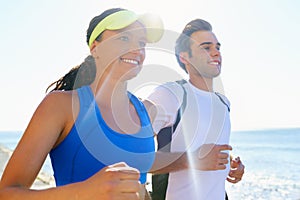 Happy couple, jog and fitness in beach, workout and active with smile, training and sunrise for run. Man, woman and