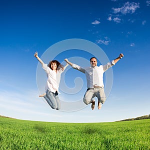 Happy couple jumping