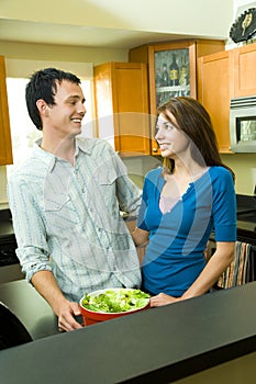 Happy couple in kitchen