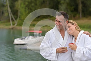 Happy couple at lake in countryside