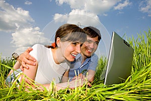 Happy couple on a laptop