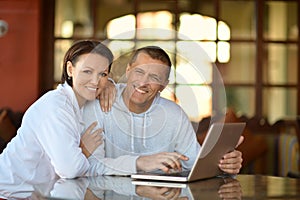 Happy couple with laptop