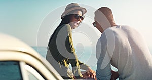 Happy couple, laughing and beach with car for road trip, funny joke or outdoor travel in nature. Young man and woman