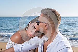 Happy couple in love on the beach. Summer vacations