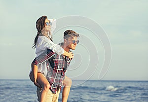 Happy couple in love on beach summer vacations.