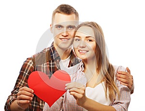 Happy couple in love holding red heart.