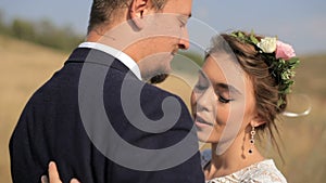 Happy couple in love in the meadows. Portrait couples, tenderness love