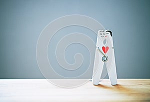 Happy couple in love. pin with painted faces of lovers