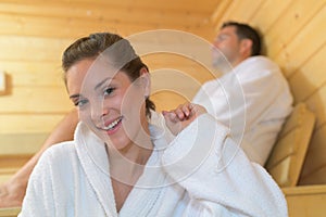 Happy couple in love relaxing at sauna