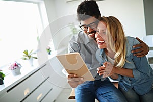 Happy couple in love surfing on tablet