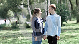 happy couple in love on a walk in the park .