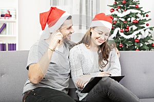 Happy couple makes a wish list for christmas