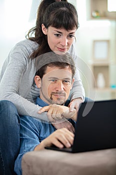 happy couple making online shopping