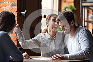 Happy couple making successful deal in cafe, purchase real estate