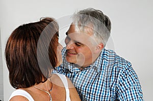Happy couple man looks in love to his wife