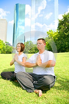 Happy Couple Meditate In Downtown Setting