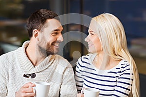 Happy couple meeting and drinking tea or coffee