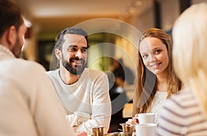 Happy couple meeting and drinking tea or coffee