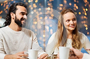 Happy couple meeting and drinking tea or coffee