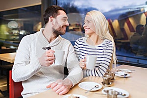 Happy couple meeting and drinking tea or coffee