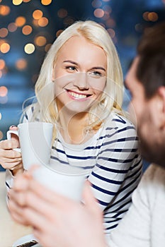 Happy couple meeting and drinking tea or coffee