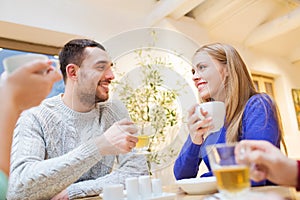 Happy couple meeting and drinking tea or coffee