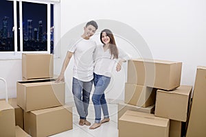 Happy couple moving into a new apartment