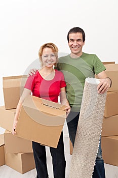 Happy couple moving into a new home