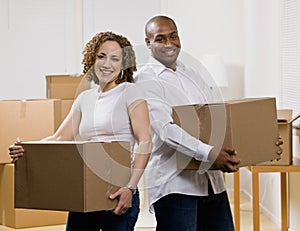 Happy couple moving into new home