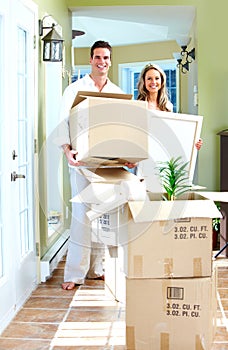 Happy couple moving in a new house.