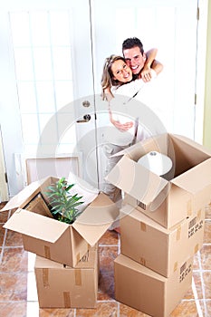 Happy couple moving in a new house.