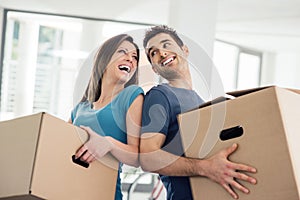 Happy couple moving in their new house