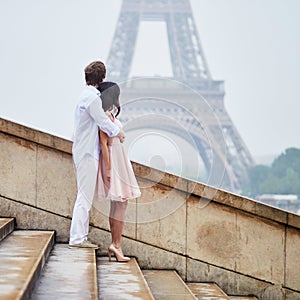 Happy couple near the Eiffel tower