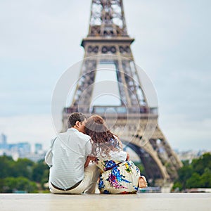 Happy couple near the Eiffel tower