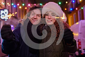 Happy couple outdoor on a cold winter evening