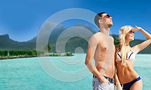 Happy couple on over bora bora background