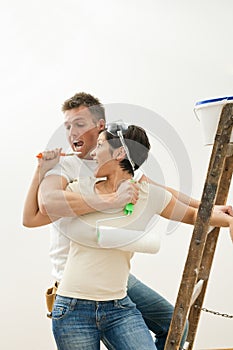 Happy couple painting