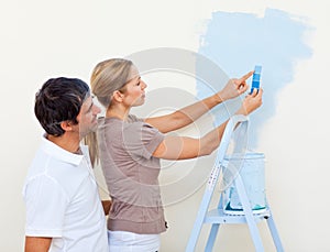 Happy couple painting together