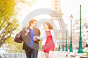 Happy couple in Paris with Eiffel Tower on background