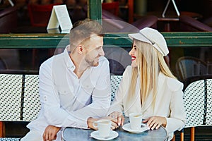 Happy couple in Parisian cafe