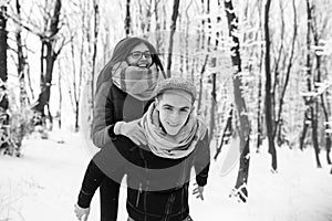 Happy couple playful together in snow park