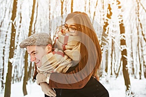 Happy couple playful together in snow park