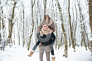 Happy couple playful together in snow park