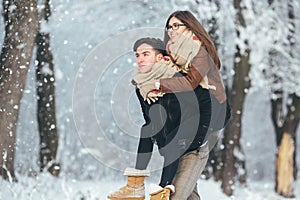 Happy couple playful together in snow park