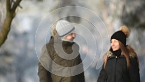 Happy couple playful together during winter holidays vocation outside in snow park. close up view