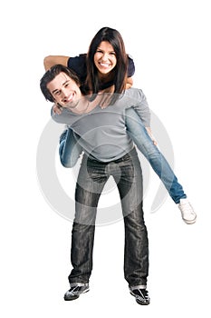 Happy couple playing piggyback together photo