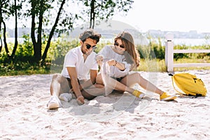 happy couple playing on sandy