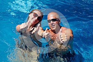 Happy couple in pool