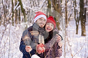 Happy couple posing with bengals at winter park